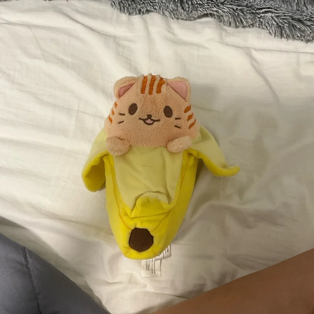 Open and close Velcro banana cat stuffy.